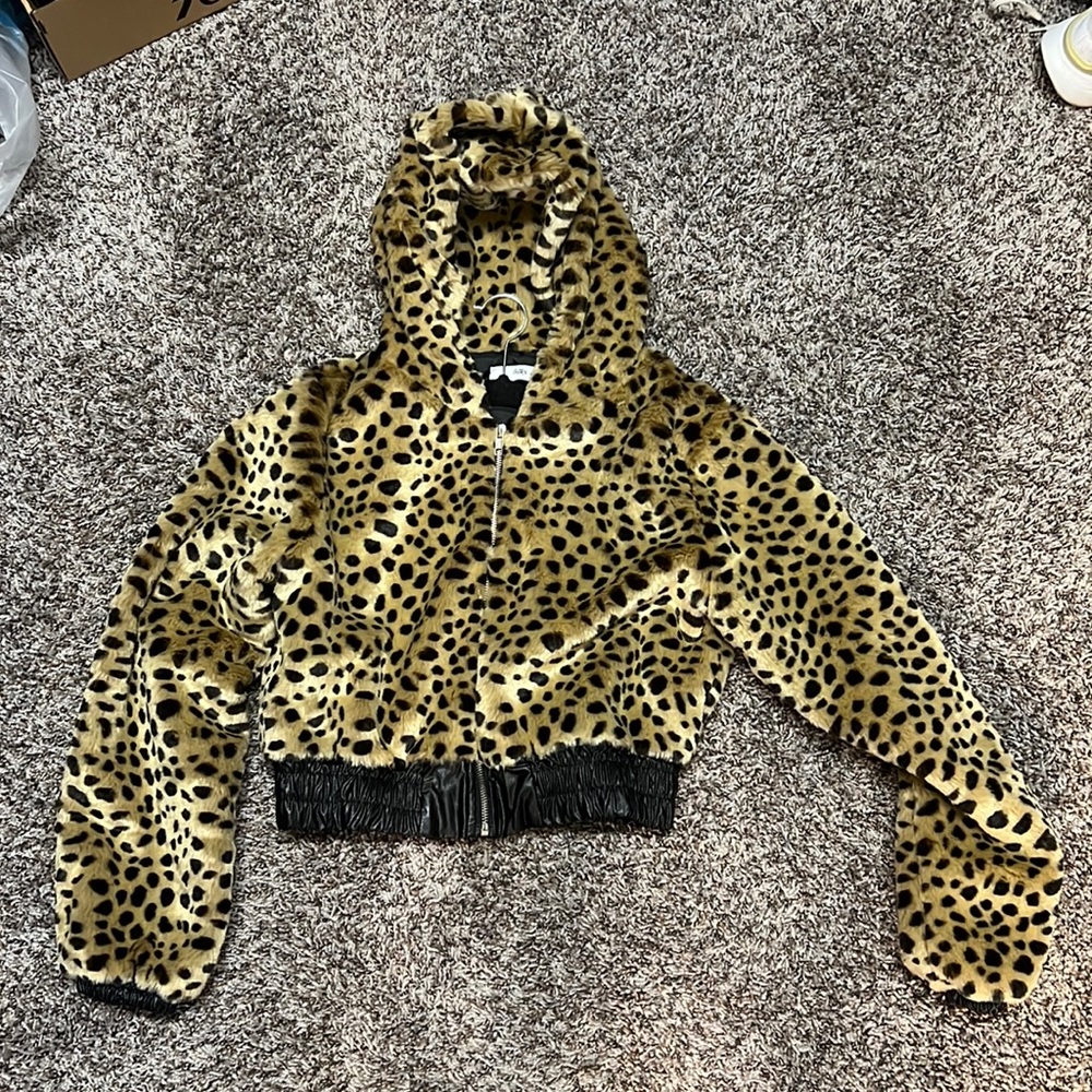 Adika cropped leopard fur jacket.